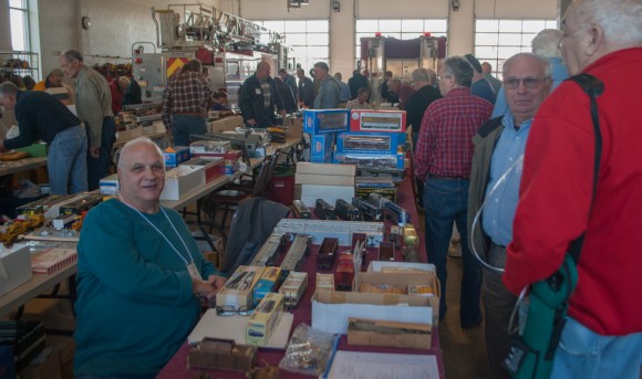 Fran Pfeil behind the table selling parts from Sunnyside Models